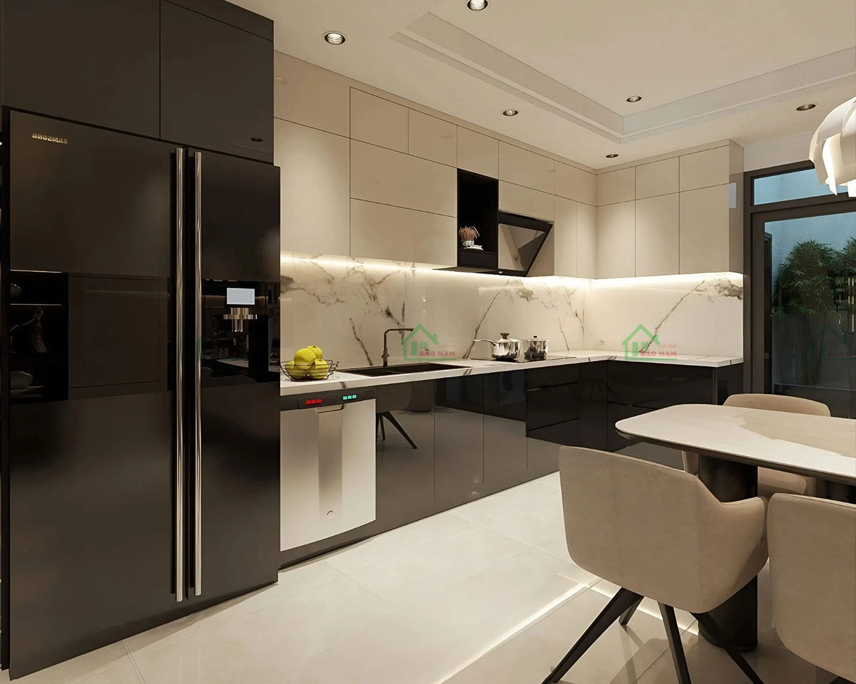 Tủ bếp acrylic chữ L màu be phối đen sang trọng, tạo sự tương phản tinh tế.