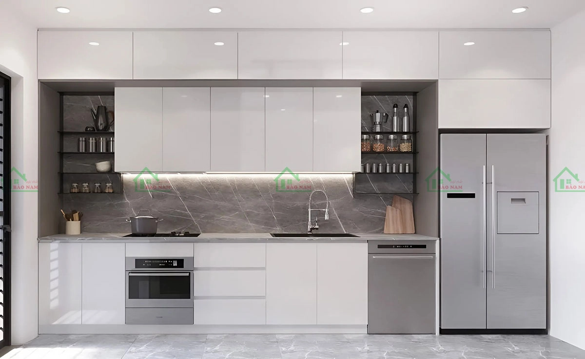 Tủ bếp Acrylic bóng gương màu trắng tinh khôi, sang trọng, hiện đại, dễ dàng vệ sinh, tạo không gian bếp sáng sủa.