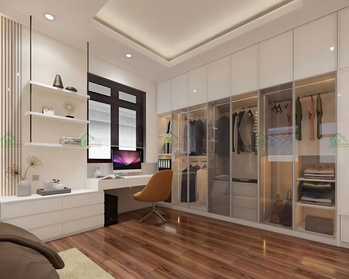 Tủ quần áo màu trắng cánh kính xám khói giúp bạn dễ dàng nhìn thấy quần áo bên trong, kết hợp với bàn làm việc tiện lợi.