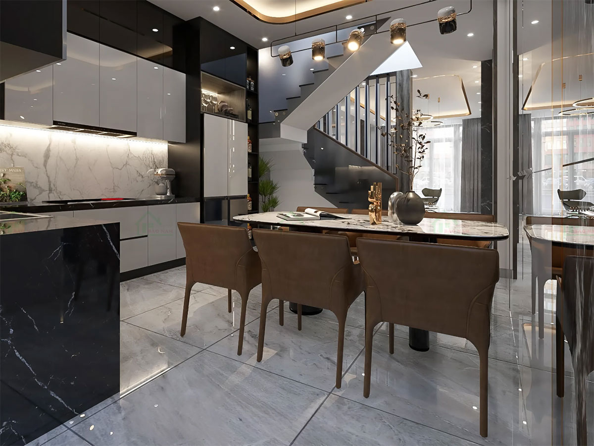 Hệ tủ bếp trên và dưới với cánh acrylic bóng gương màu xám nhạt, mang lại vẻ sang trọng và sáng sủa cho không gian.