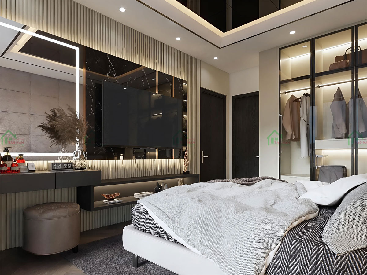 Kệ tivi tích hợp các tiện ích như hệ thống âm thanh và ánh sáng, tạo thành một khu vực giải trí đầy tiện nghi.