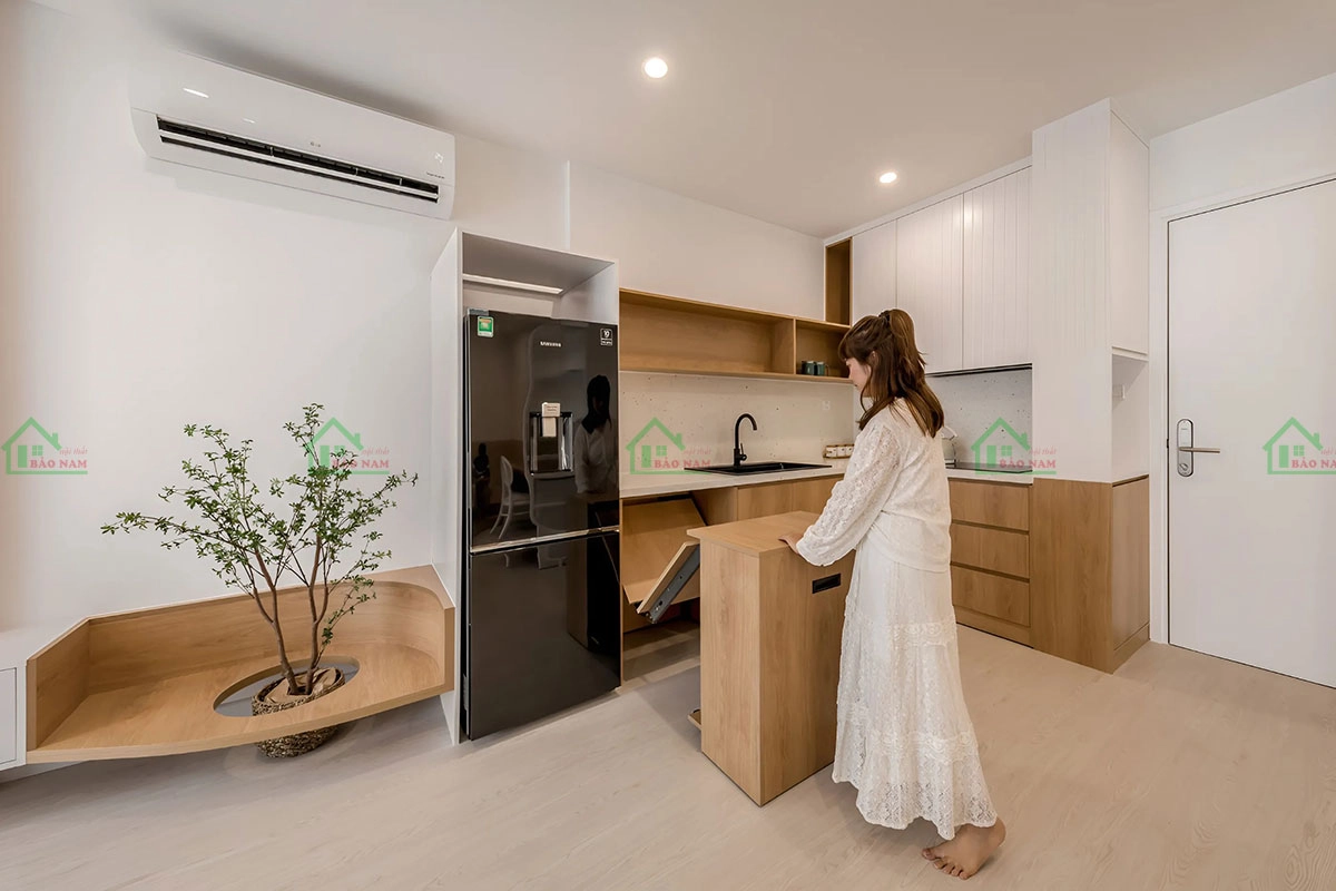 Mẫu tủ bếp tích hợp đảo bếp, tạo không gian làm việc và nấu nướng tiện lợi.