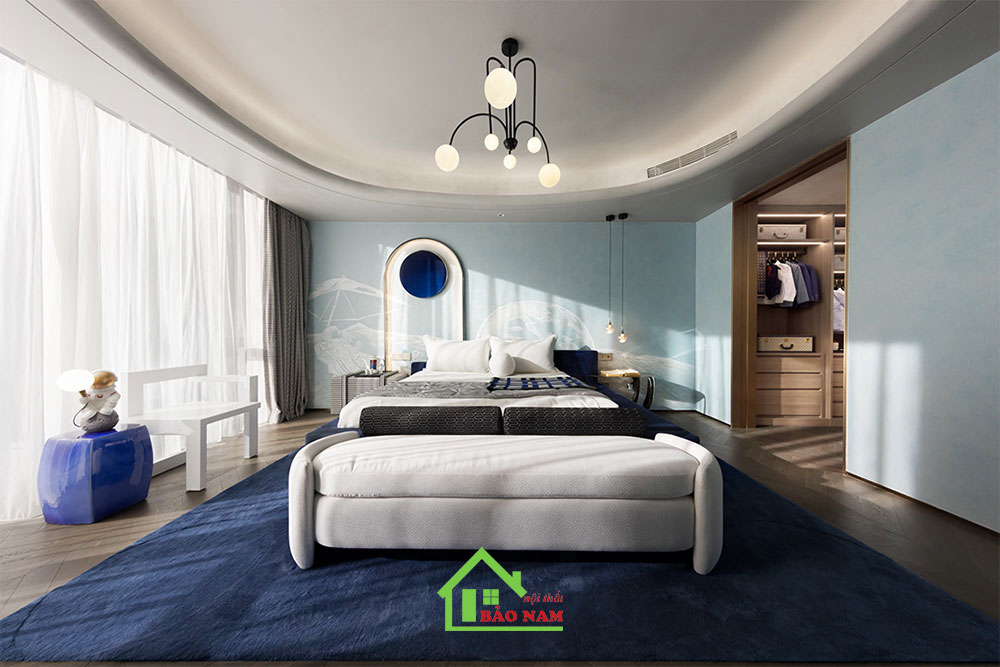Thiết kế nội thất Đại Dương sử dụng các gam màu xanh dương, kết hợp gỗ và vải, tạo không gian thư giãn.